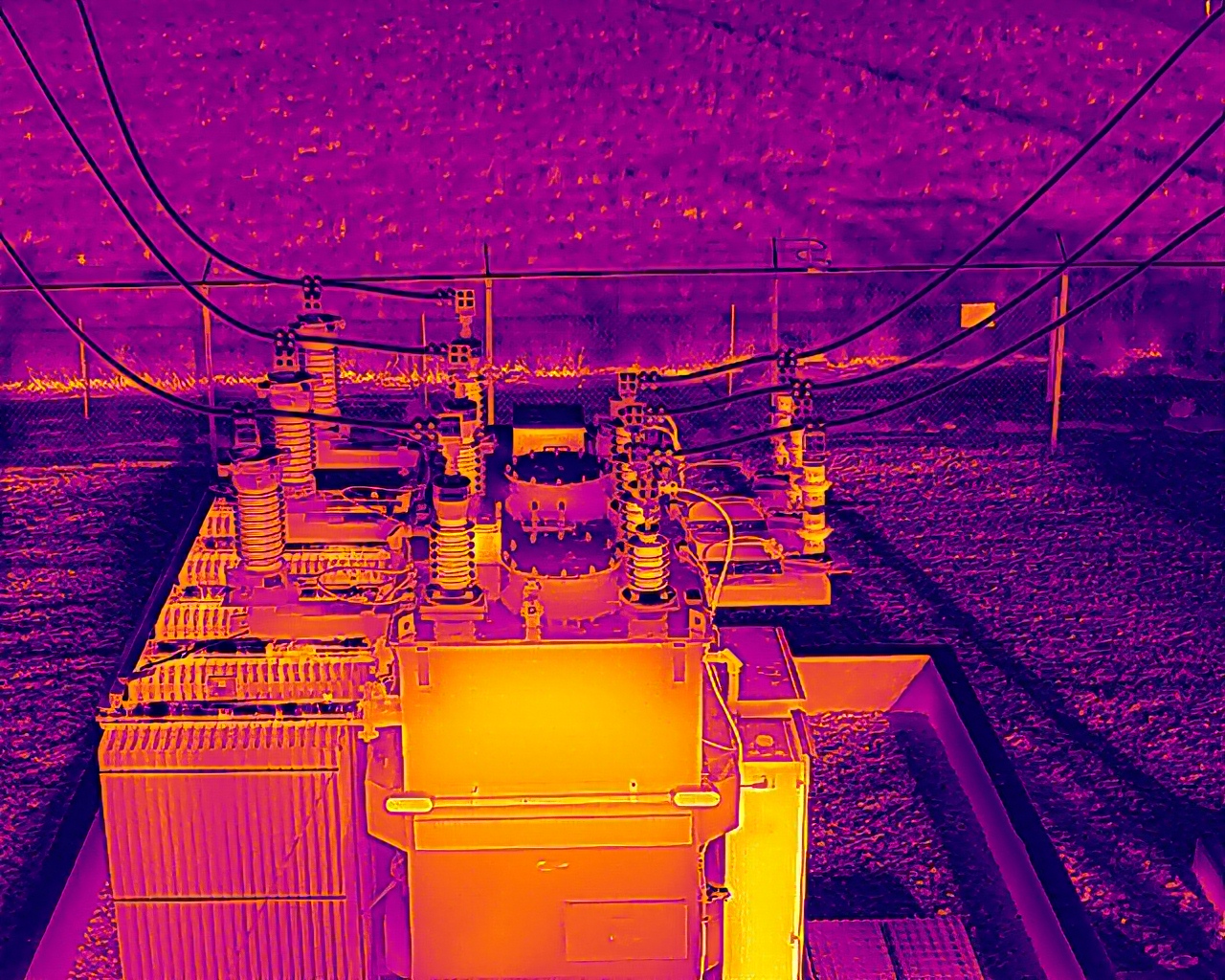 Aerial thermal image — Distribution substation transformer with primary bushings and connection hardware